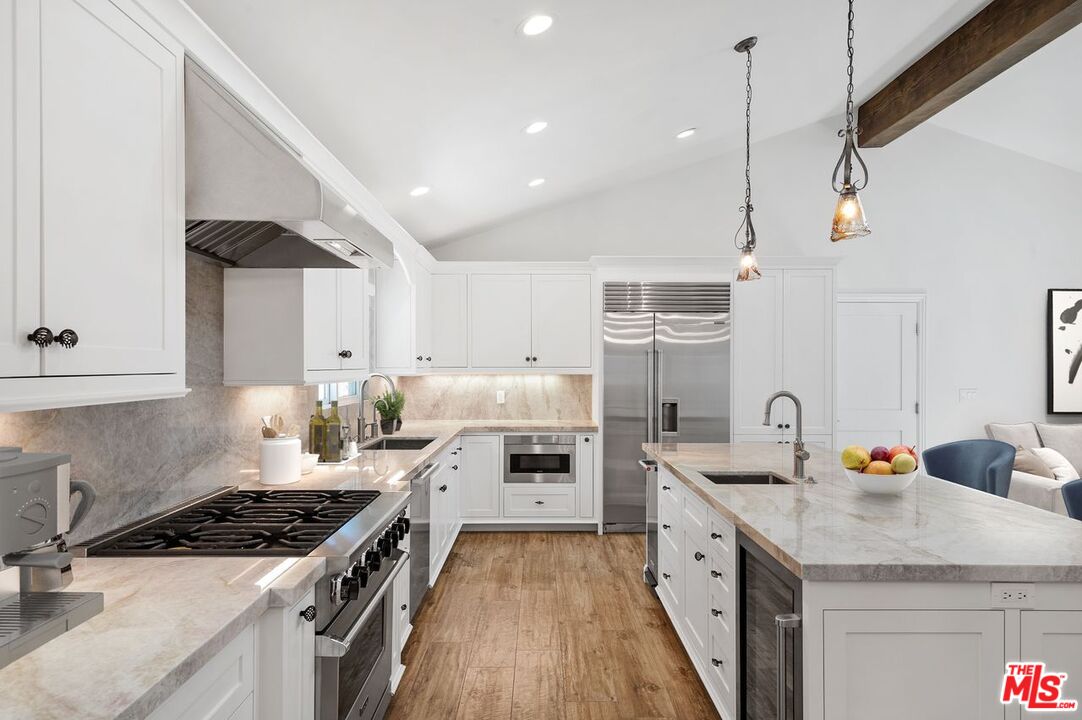 5040 Terramar Way Oxnard, CA 93035 - Photo 3 of 16 a kitchen with a sink stove and cabinets