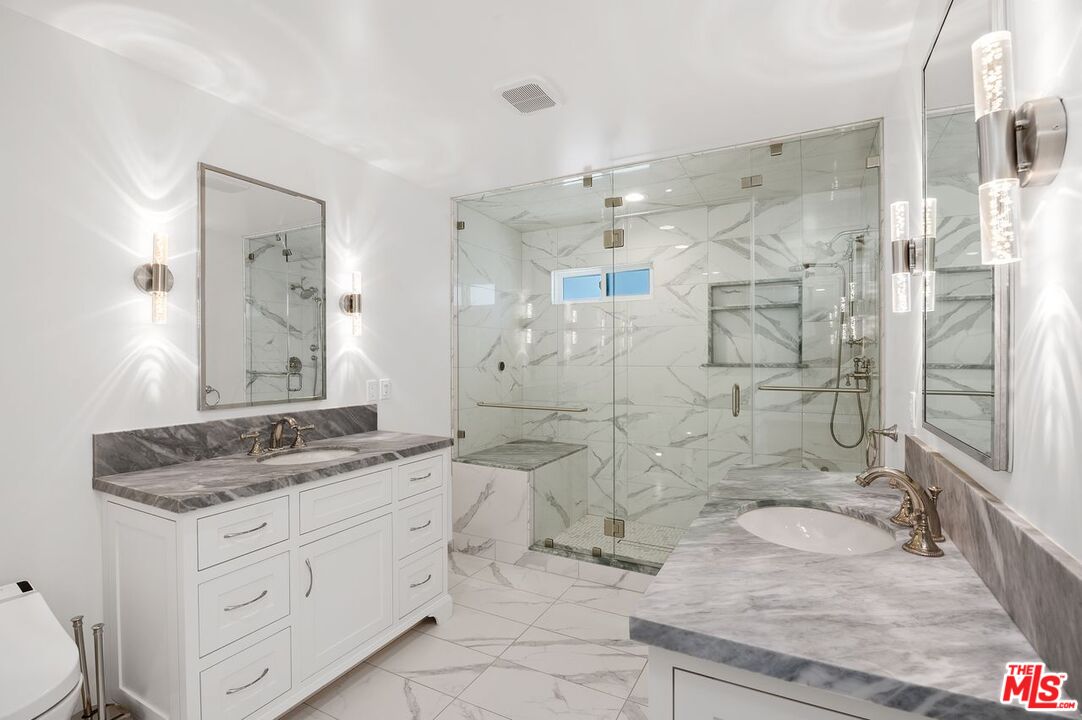 5040 Terramar Way Oxnard, CA 93035 - Photo 8 of 16 a spacious bathroom with a granite countertop sink mirror and shower