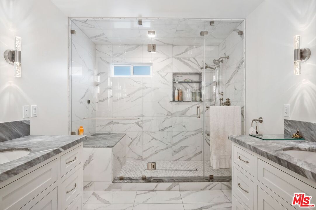 5040 Terramar Way Oxnard, CA 93035 - Photo 9 of 16 a bathroom with a granite countertop sink mirror and shower