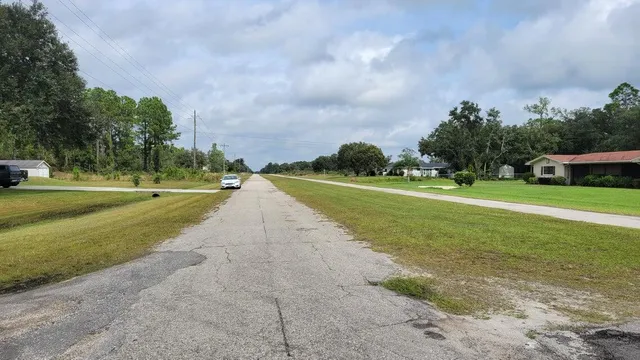 a view of an outdoor space and tennis court