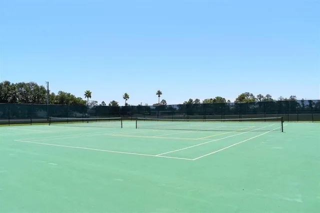 a view of outdoor space with wooden floor and lake