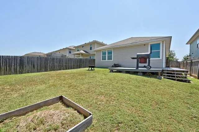 a backyard of a house with lots of green space