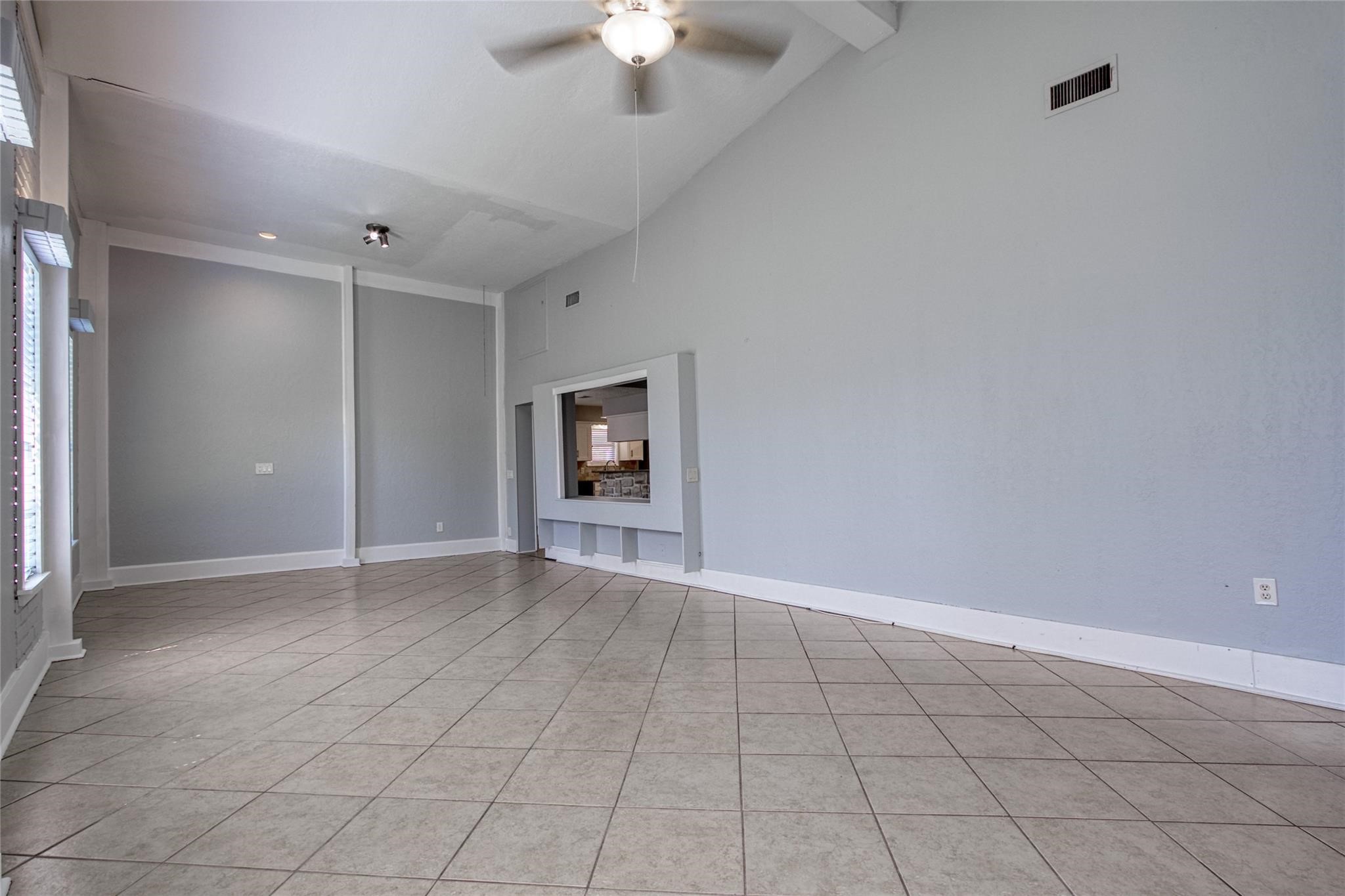 9715 Ballin David Drive Spring, TX 77379 - Photo 11 of 20 an empty room with fan and windows