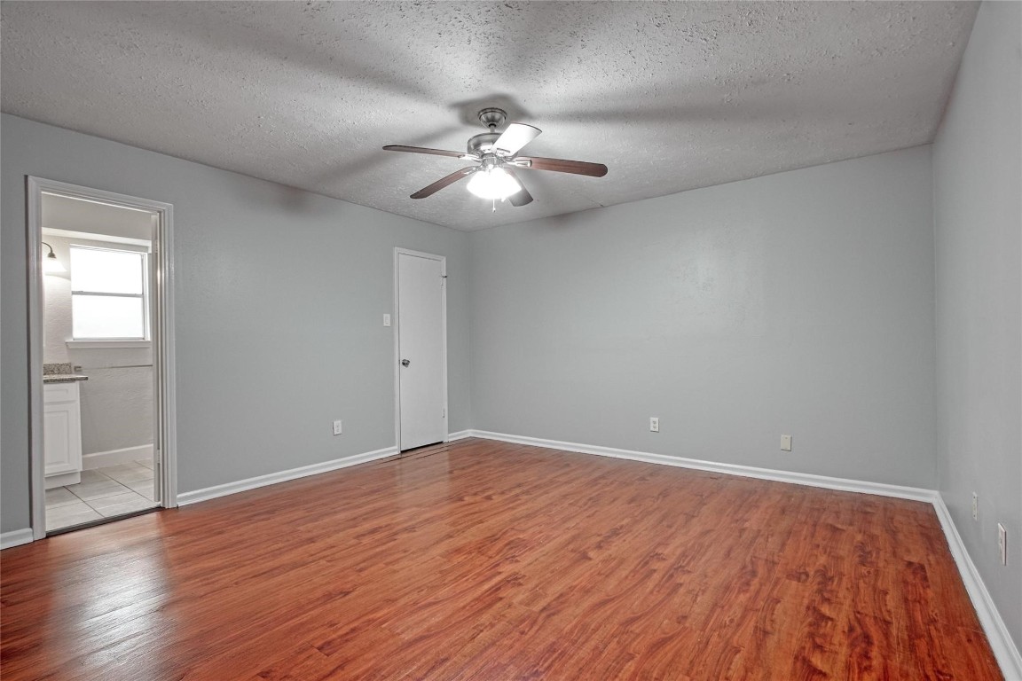 9715 Ballin David Drive Spring, TX 77379 - Photo 13 of 20 a view of an empty room with wooden floor