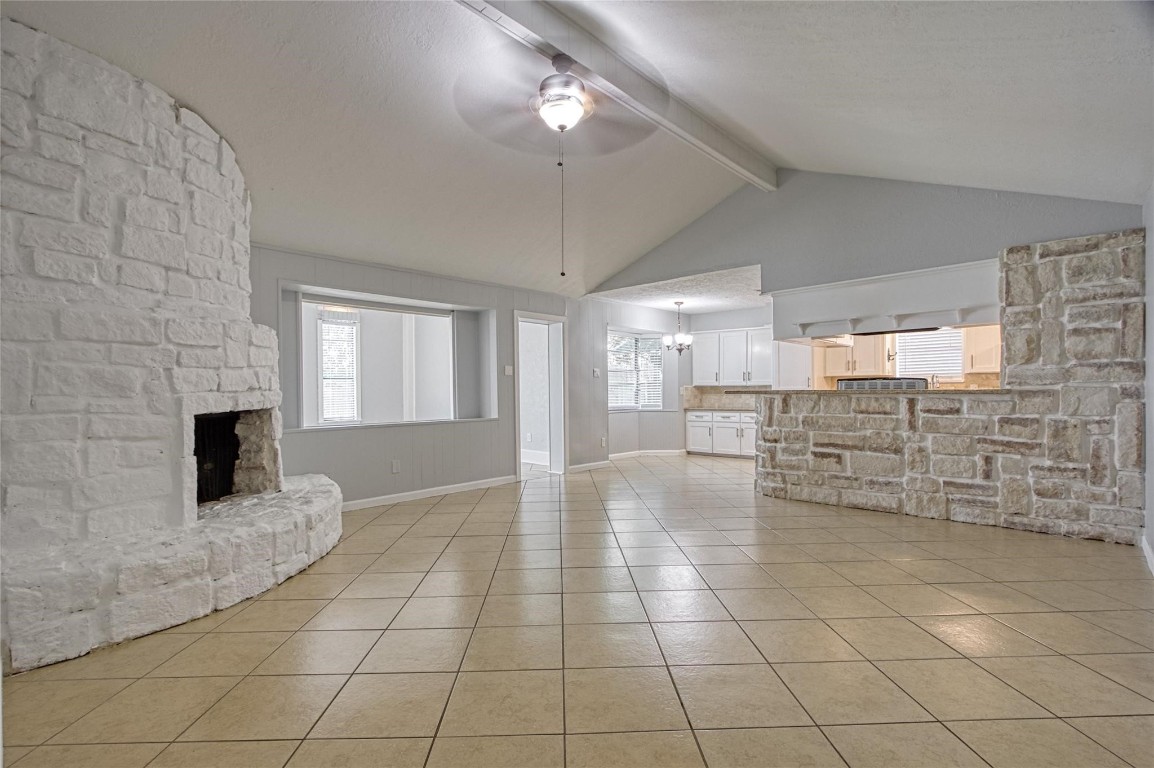 9715 Ballin David Drive Spring, TX 77379 - Photo 5 of 20 a view of open kitchen with granite countertop a sink and a stove top oven