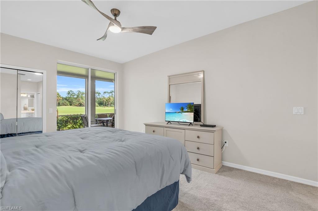 6025 Pinnacle Lane, Unit 602 Naples, FL 34110 - Photo 19 of 43 a bedroom with a bed and a dresser