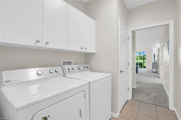 a view of storage and utility room with washer and dryer