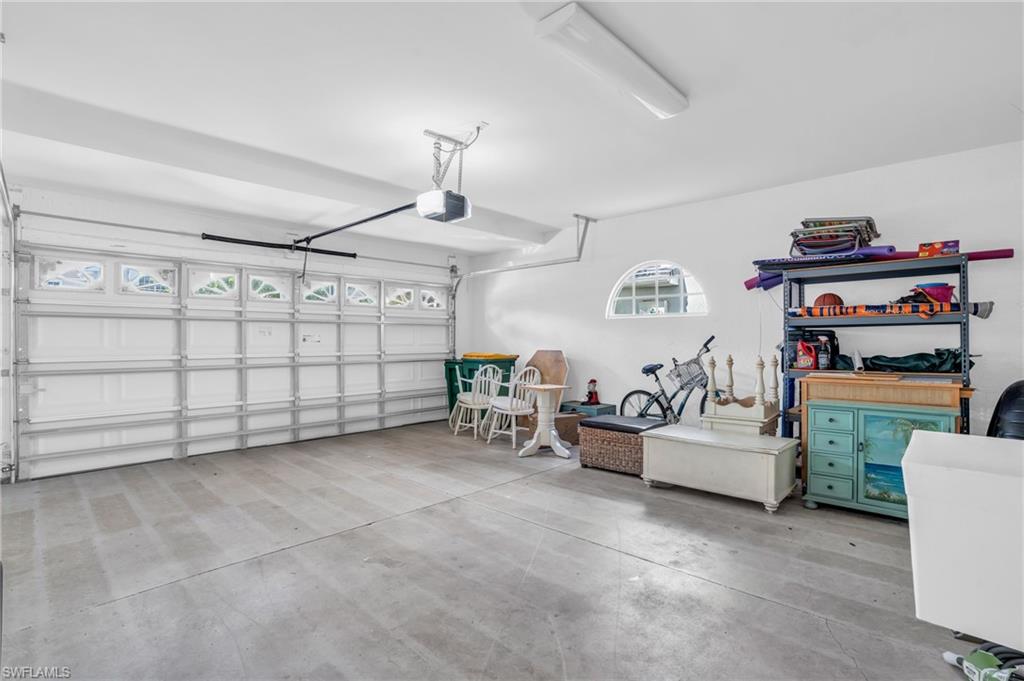 6025 Pinnacle Lane, Unit 602 Naples, FL 34110 - Photo 24 of 43 a view of a livingroom with furniture and toys
