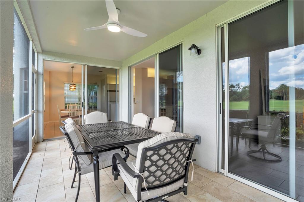 6025 Pinnacle Lane, Unit 602 Naples, FL 34110 - Photo 25 of 43 a room with furniture and wooden floor