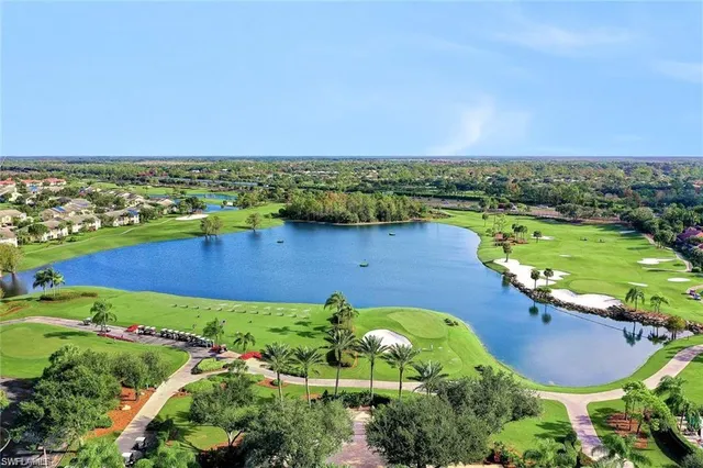 a view of a swimming pool with a garden and deck