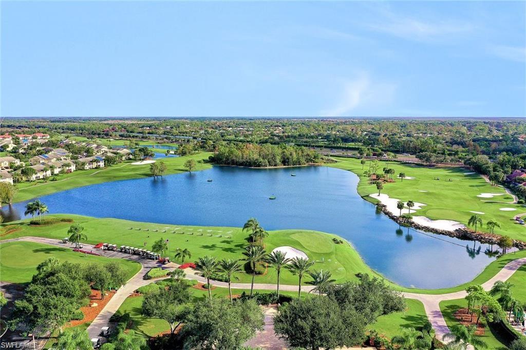 6025 Pinnacle Lane, Unit 602 Naples, FL 34110 - Photo 32 of 43 an aerial view of a residential houses with outdoor space and lake view