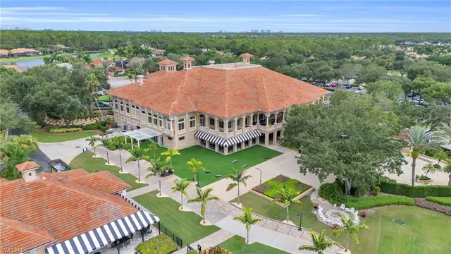 an aerial view of a house with outdoor space and lake view