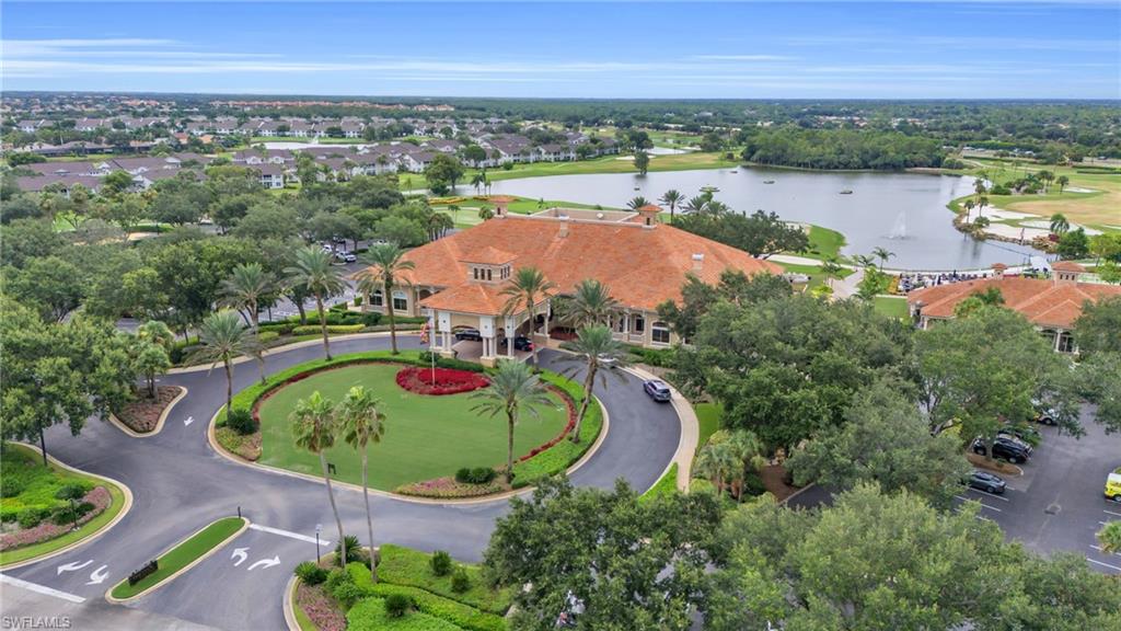 6025 Pinnacle Lane, Unit 602 Naples, FL 34110 - Photo 34 of 43 an aerial view of a house with outdoor space and lake view
