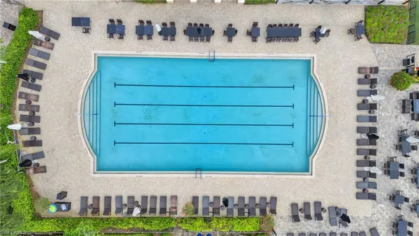 an aerial view of a house with a swimming pool
