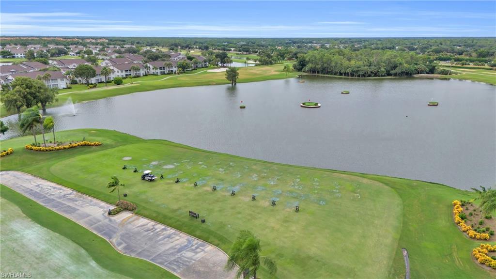 6025 Pinnacle Lane, Unit 602 Naples, FL 34110 - Photo 42 of 43 a view of a lake with a city view