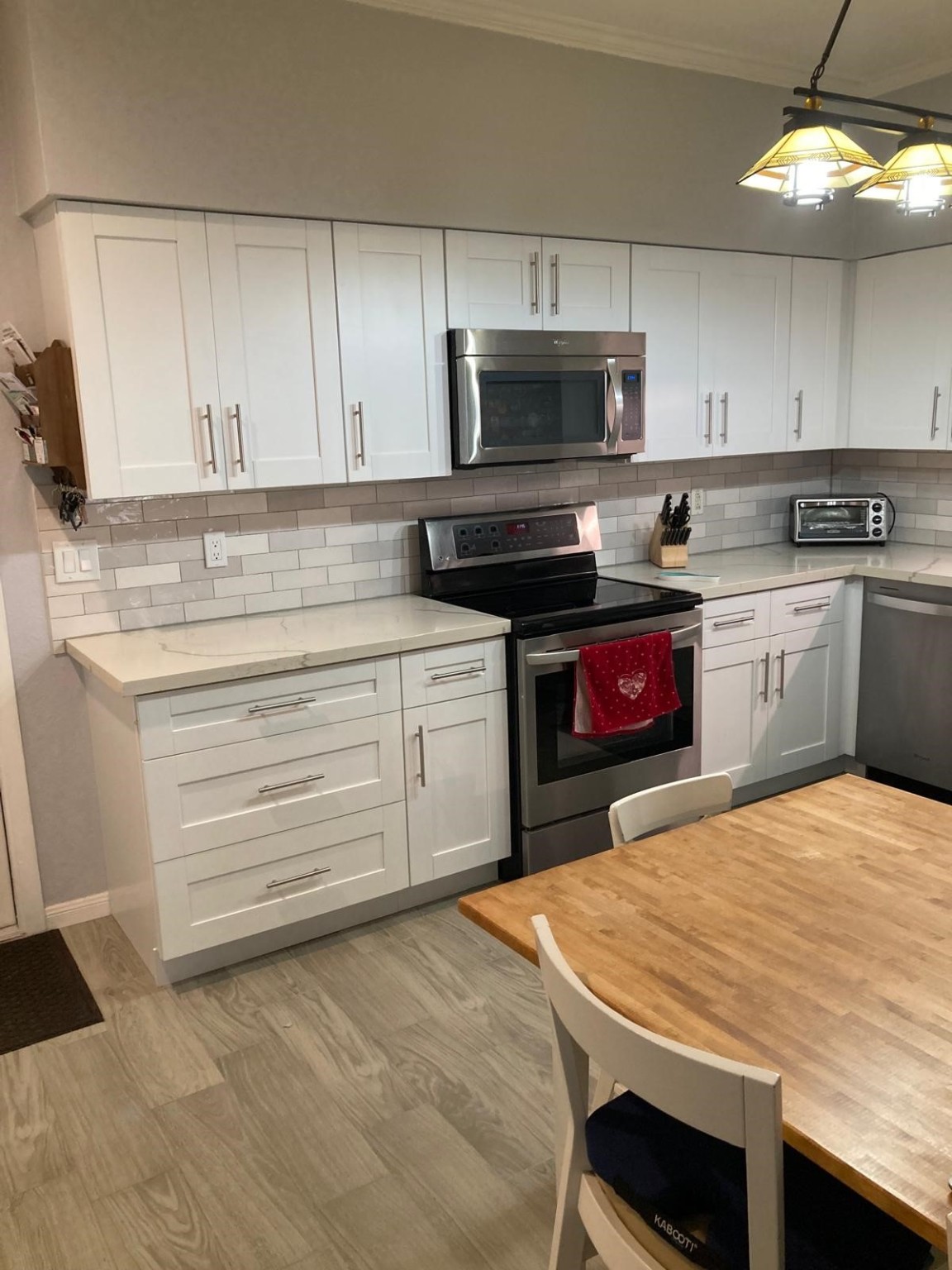 1623 Prairie Grove Drive Houston, TX 77077 - Photo 18 of 50 a kitchen with a stove a sink and a microwave
