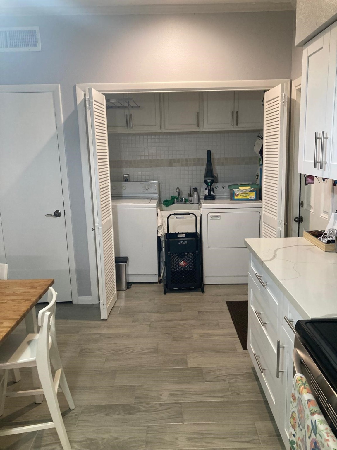 1623 Prairie Grove Drive Houston, TX 77077 - Photo 25 of 50 a kitchen with stainless steel appliances a stove a sink and a refrigerator