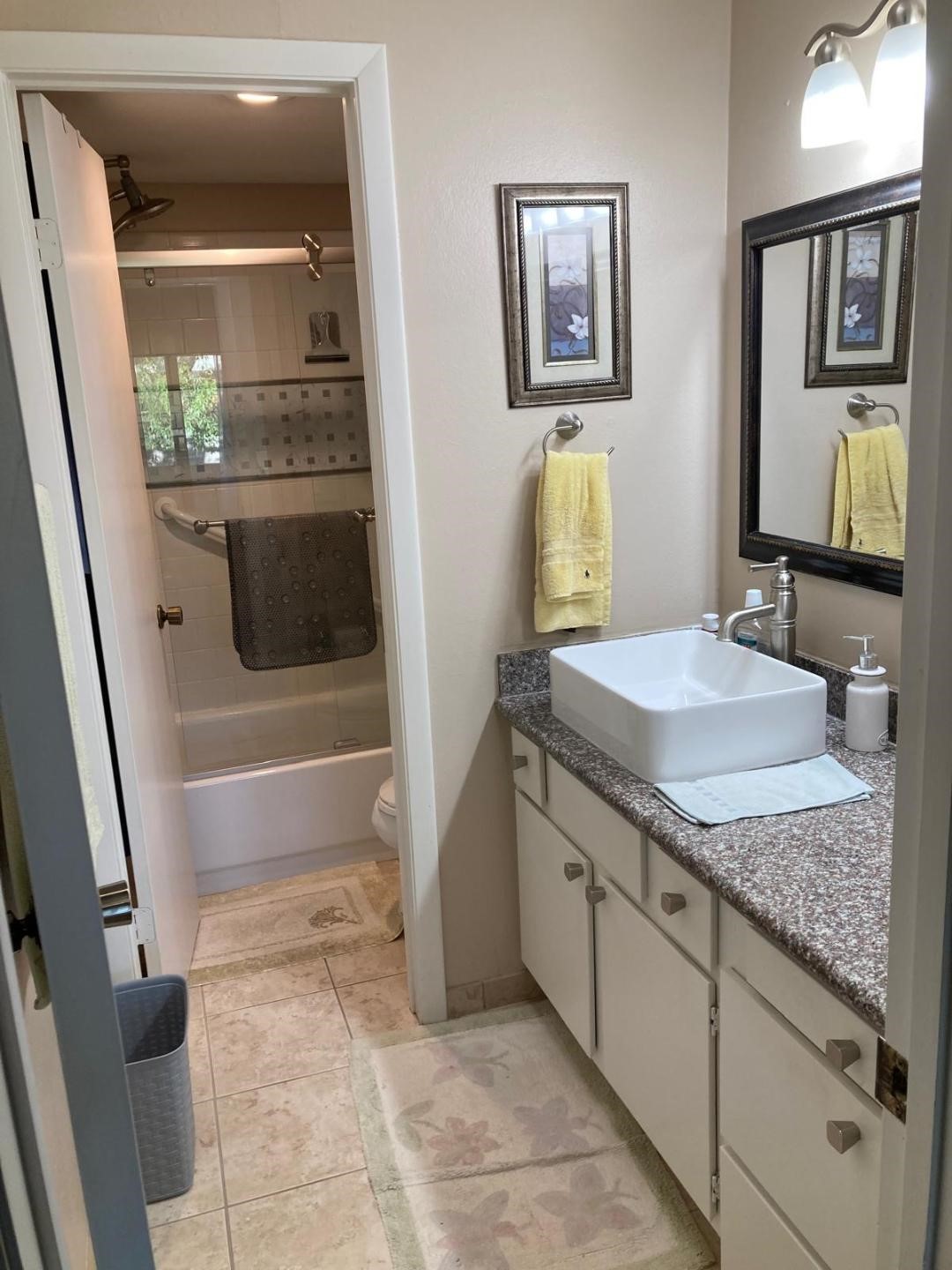 1623 Prairie Grove Drive Houston, TX 77077 - Photo 34 of 50 a bathroom with a granite countertop sink a mirror and bathtub