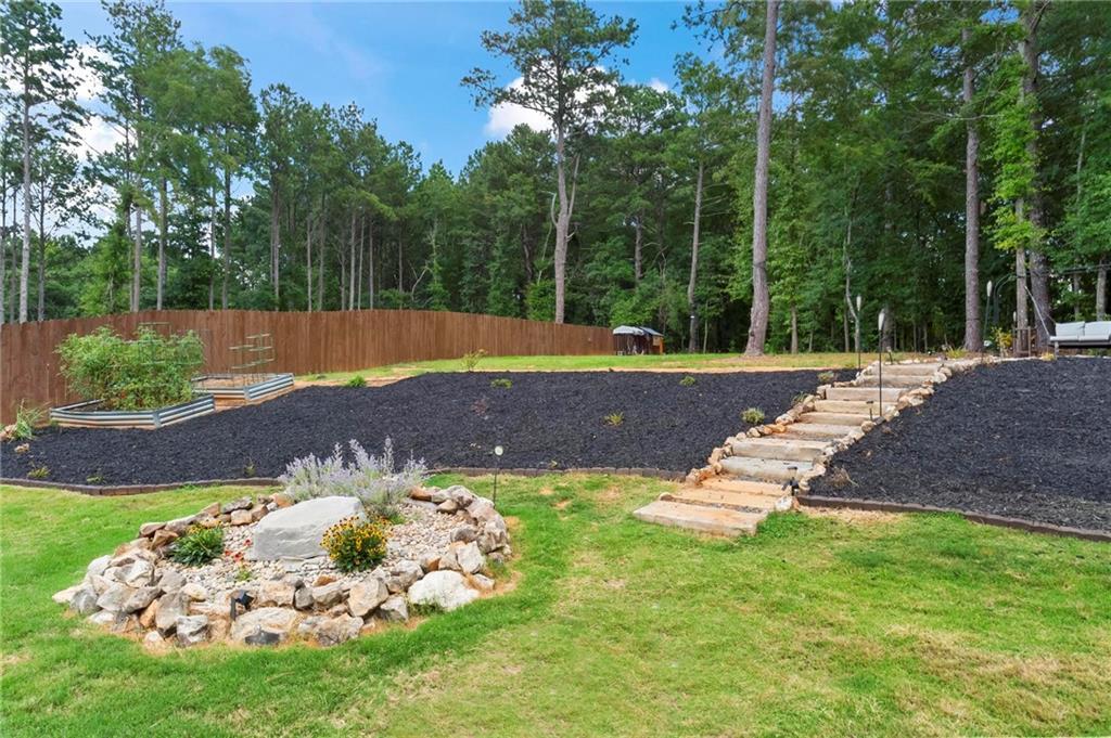 2081 Nunnally Farm Road Monroe, GA 30655 - Photo 39 of 44 a view of a backyard with a garden