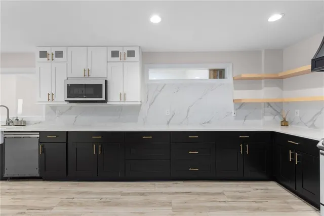 a view of a room with wooden floor and a window