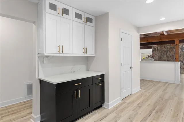 a view of a room with wooden floor