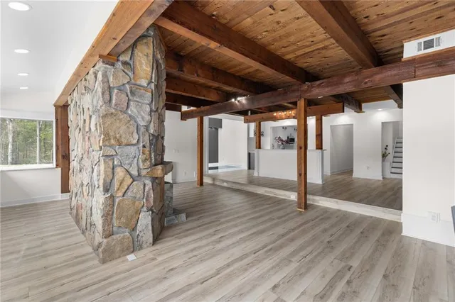 a bathroom with a double vanity sink toilet and shower