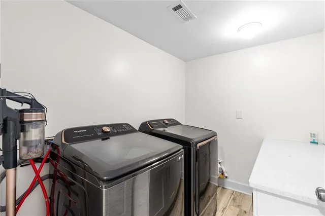 a view of an entryway with wooden floor