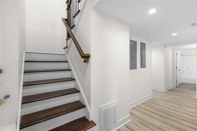 a view of an entryway with wooden floor