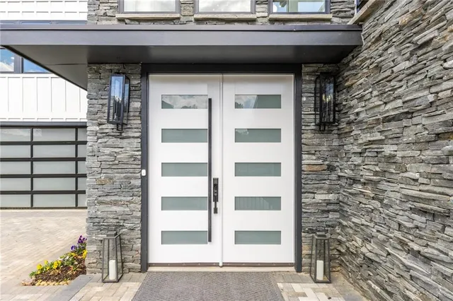 a large kitchen with stainless steel appliances a sink counter space and cabinets