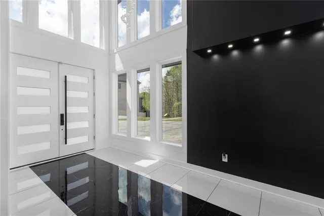 a view of an empty room with a balcony