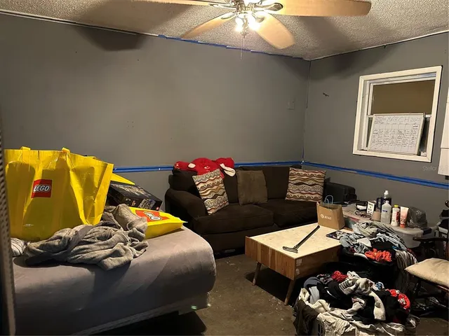 a bedroom with a bed and a lamp