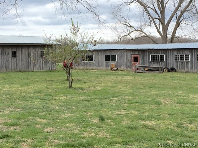6019 Burleigh Road Gloucester, VA 23061 - Photo 5 of 12 More storage barns at the side/rear of the home.