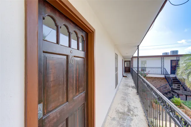 a view of a balcony and chairs