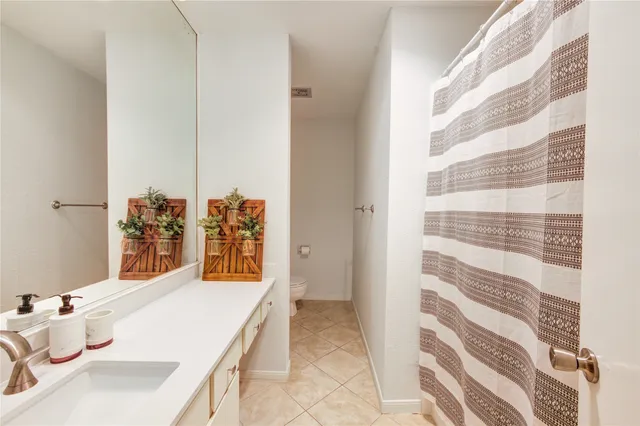 a bathroom with a sink and mirror