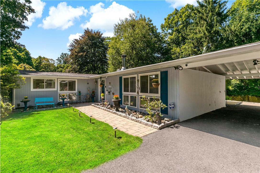 Charming move in ready no step ranch in natural setting!