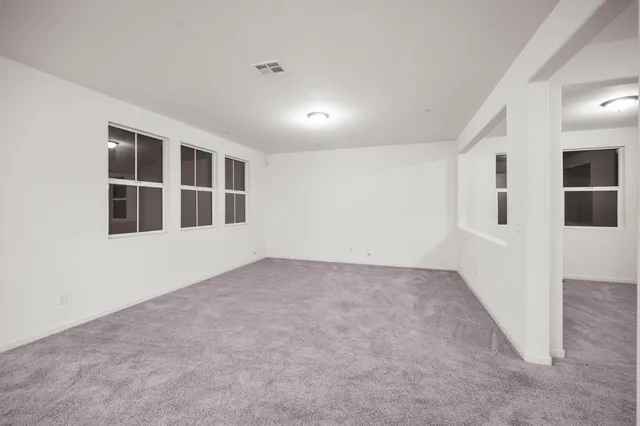 a kitchen with stainless steel appliances white cabinets and stove