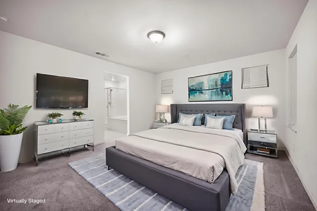 a spacious bathroom with a double vanity sink mirror and double