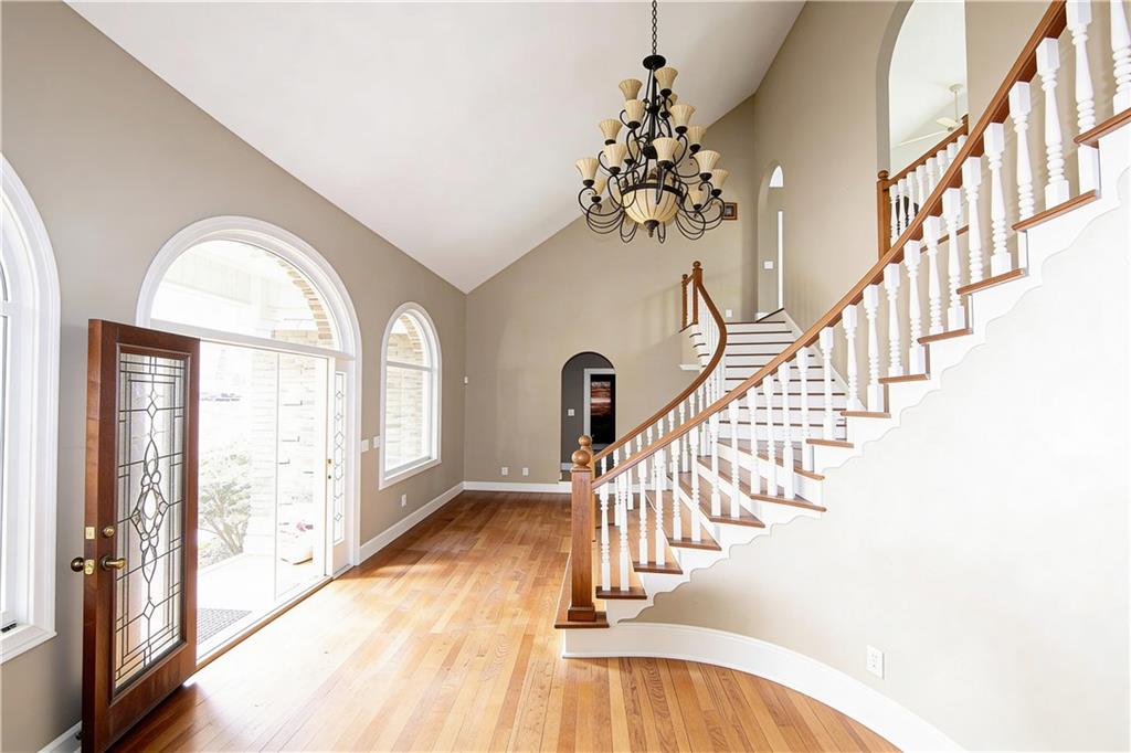 10060 Buice Road Alpharetta, GA 30022 - Photo 15 of 75 a view of entryway and hall with wooden floor