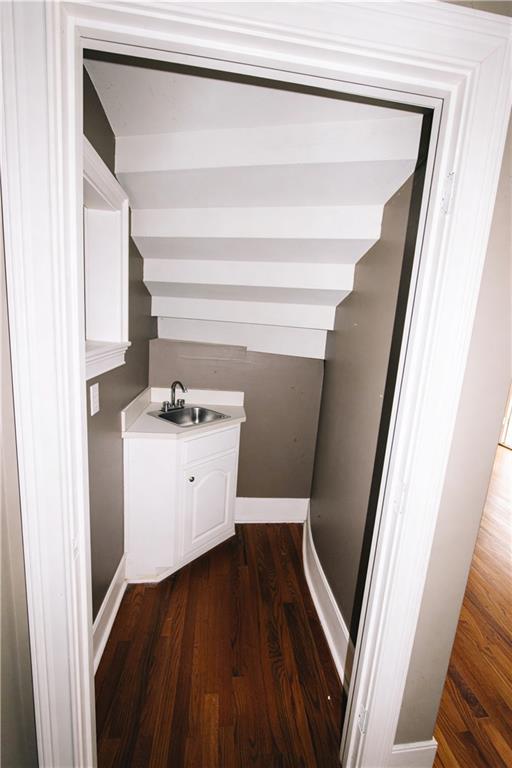 10060 Buice Road Alpharetta, GA 30022 - Photo 26 of 75 a view of washer and dryer with wooden floor