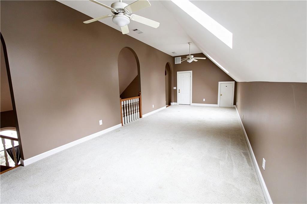 10060 Buice Road Alpharetta, GA 30022 - Photo 42 of 75 a view of a livingroom with a staircase