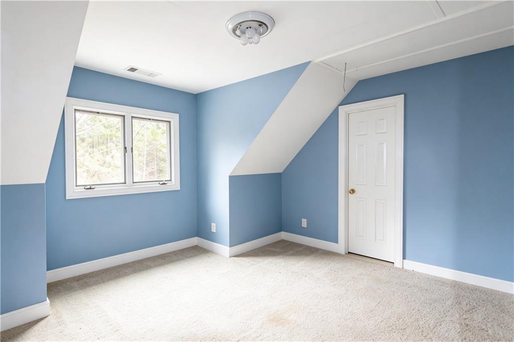 10060 Buice Road Alpharetta, GA 30022 - Photo 44 of 75 a view of an empty room with a window