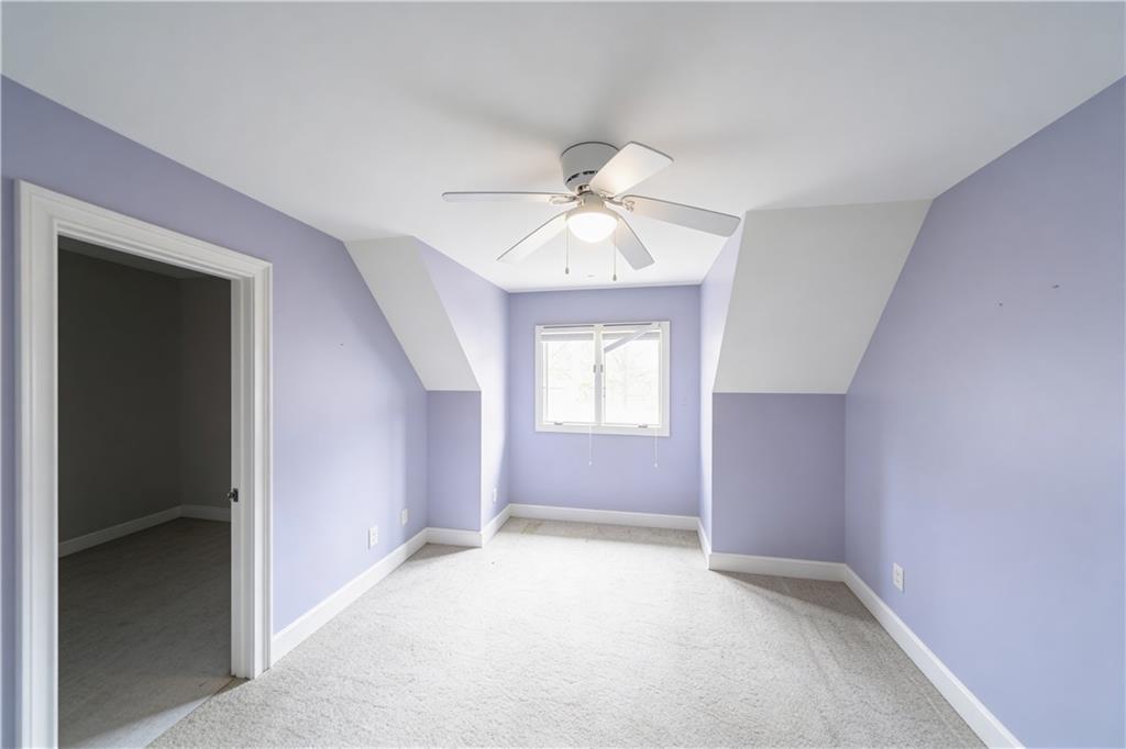 10060 Buice Road Alpharetta, GA 30022 - Photo 49 of 75 wooden floor in an empty room with a window