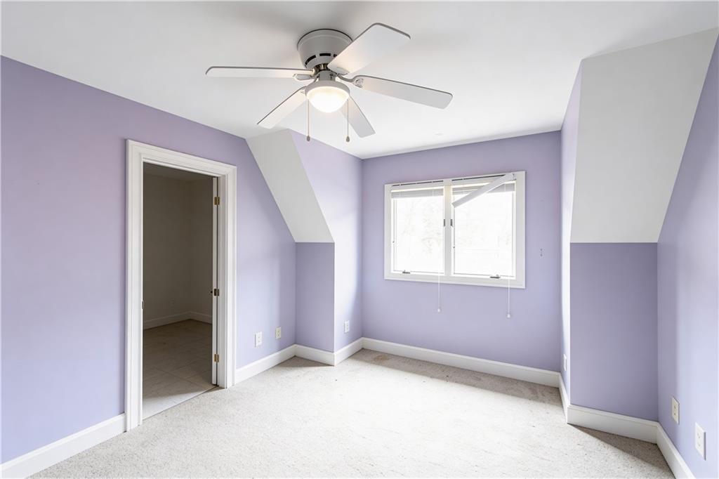 10060 Buice Road Alpharetta, GA 30022 - Photo 50 of 75 a view of an empty room with a window