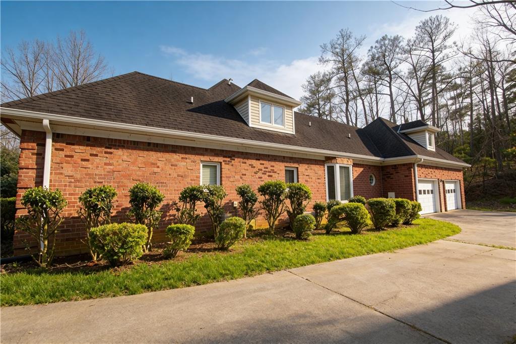 10060 Buice Road Alpharetta, GA 30022 - Photo 5 of 75 a front view of house with garden