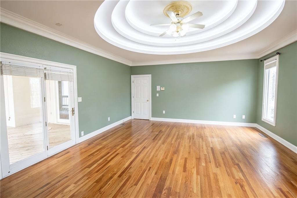 10060 Buice Road Alpharetta, GA 30022 - Photo 54 of 75 a view of an empty room and wooden floor
