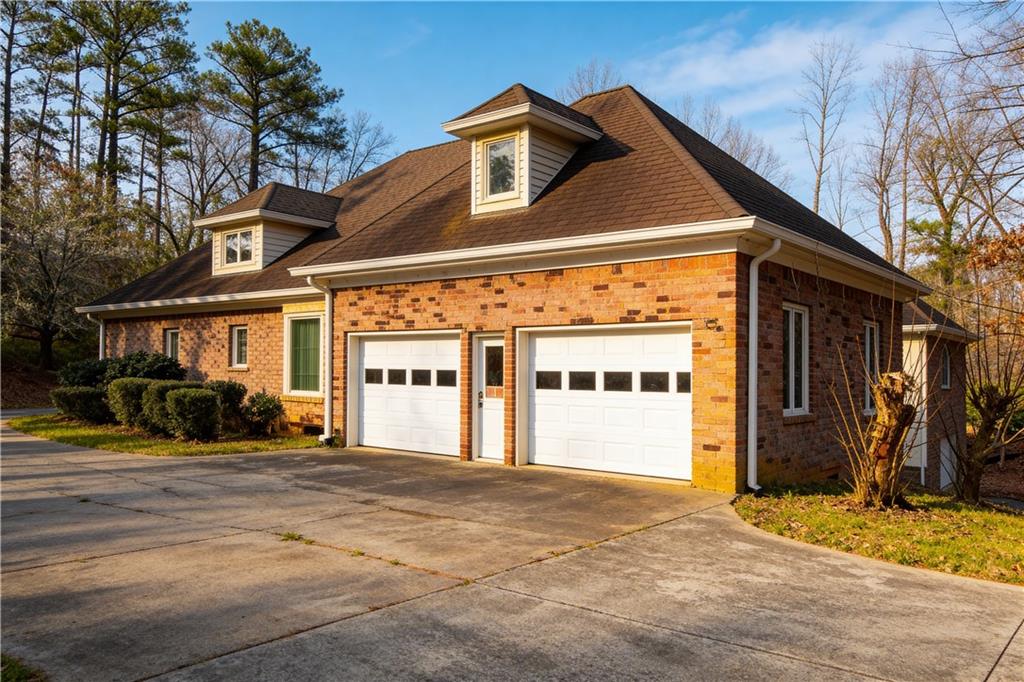 10060 Buice Road Alpharetta, GA 30022 - Photo 6 of 75 a front view of a house with a outdoor space