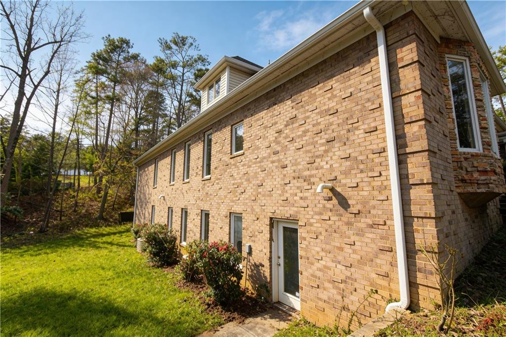 10060 Buice Road Alpharetta, GA 30022 - Photo 7 of 75 a front view of a house with garden