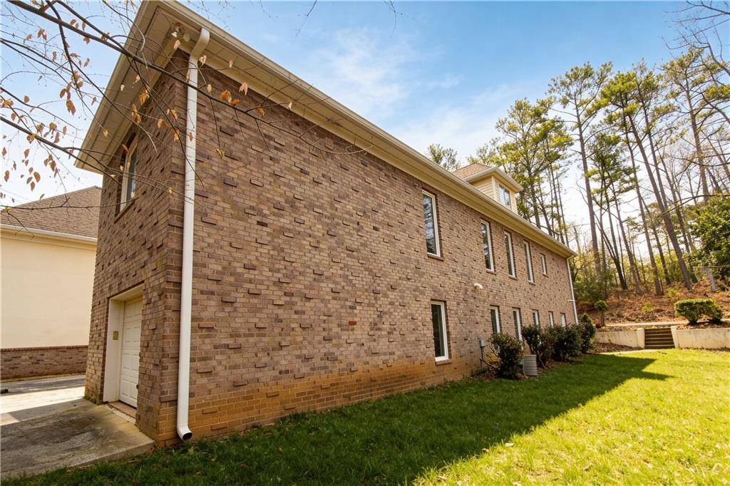 10060 Buice Road Alpharetta, GA 30022 - Photo 9 of 75 a view of a back yard of the house