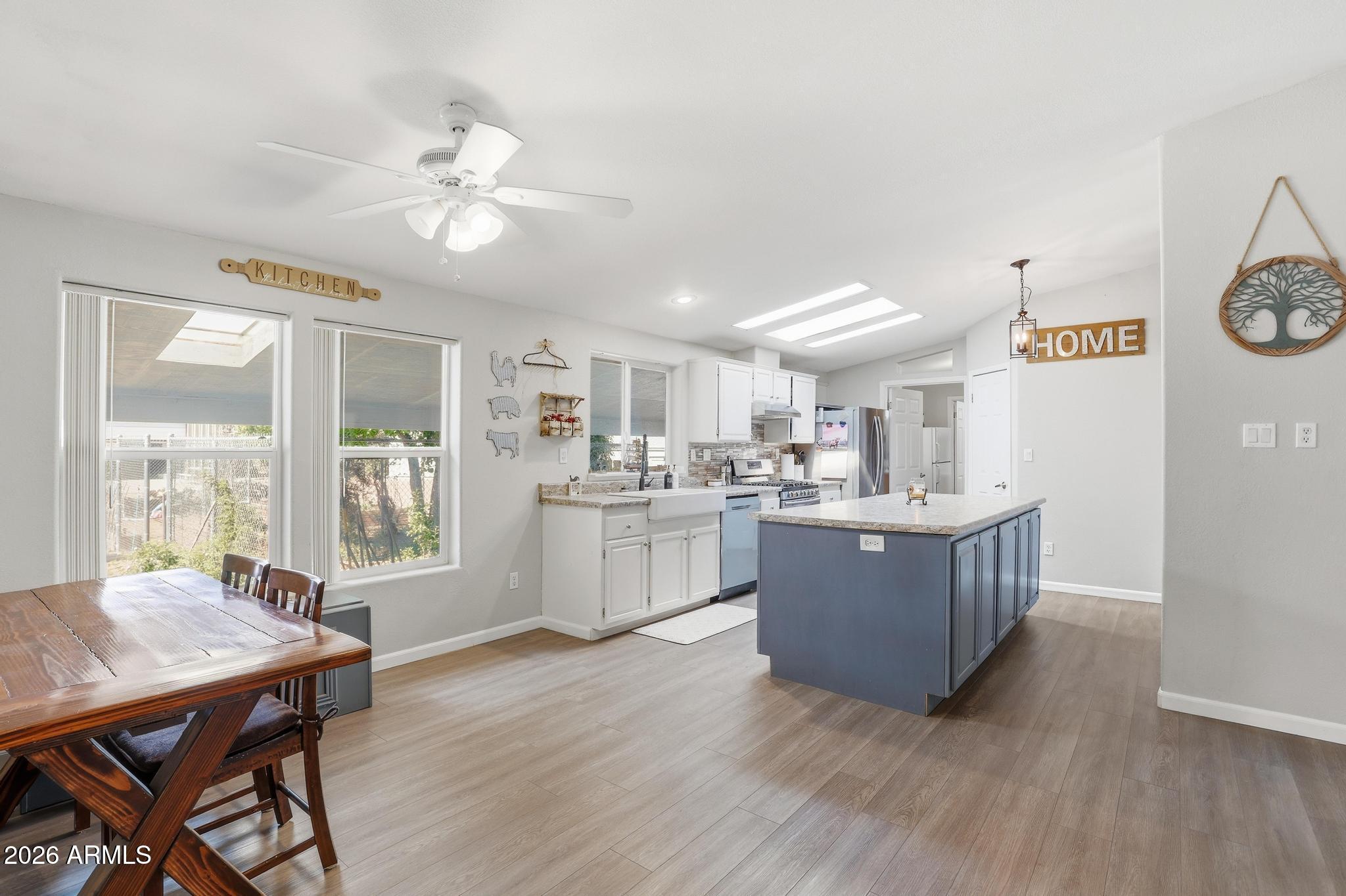 191 Cornerstone Way Payson, AZ 85541 - Photo 11 of 37 a living room with kitchen island furniture and a kitchen view
