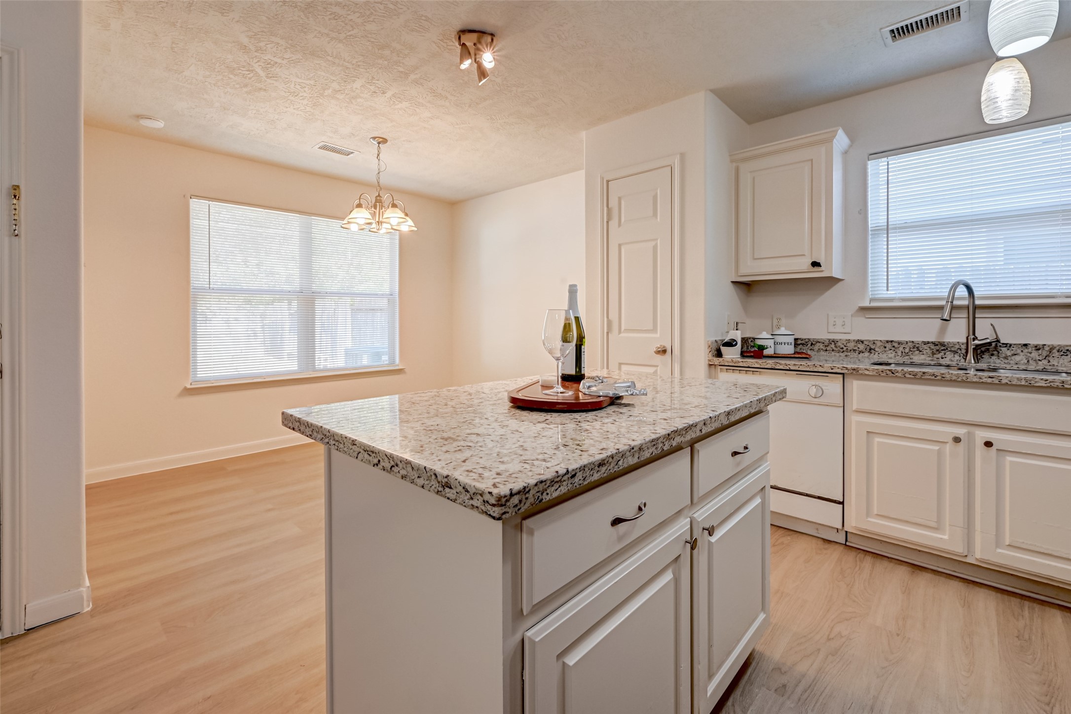 4830 Comal River Loop Spring, TX 77386 - Photo 15 of 43 a kitchen with stainless steel appliances granite countertop a sink a stove cabinets and wooden floor